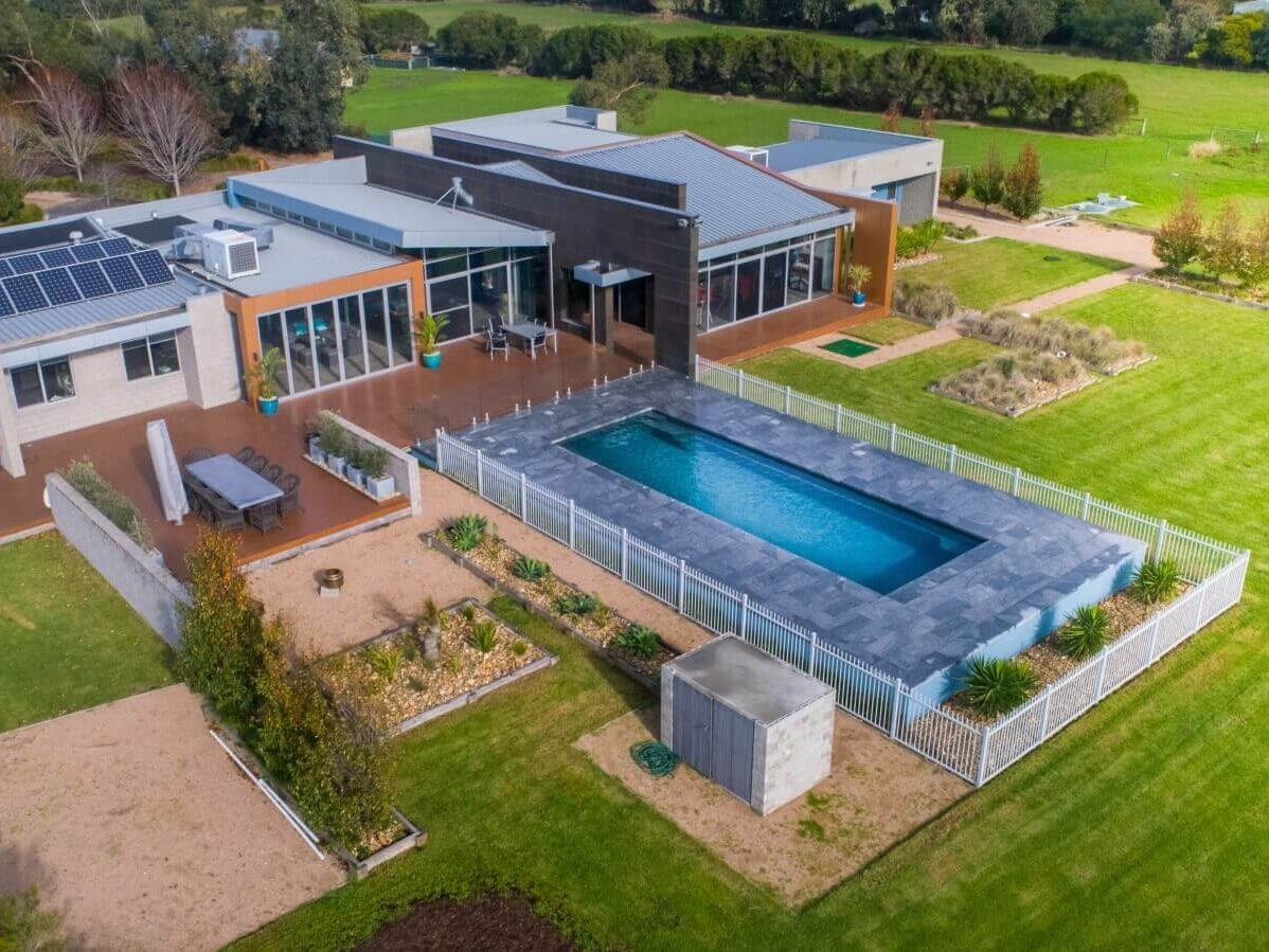 Compass Pool installed partially above the ground